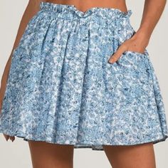 Light Blue And Navy Floral Skirt With Side Pockets. Fully Lined With Elastic Waistband. Easy Throw On For A Casual Summer Day. Pair It Up With The Denim Santa Fe Cinched Blouse By Elan For The Perfect Look (Eicvp4135) 04/06/24 Santa Fe Style, Ruffle Mini Skirt, High Waist Fashion, Matching Top, Denim Mini, Navy Floral, Denim Mini Skirt, White Denim, Cropped Jeans