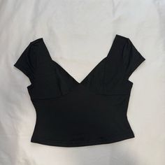 Black Wide V Neck Top Really Pretty Design And Stitching Modern Wide Neck Top Baby Tee Deep V Neck Black Crop Top Black Off The Shoulder Top Black Wide Neckline Top Black Stretch V-neck Crop Top, Black V-neck Top For Night Out, Solid V-neck Crop Top For Party, Black Short Sleeve Crop Top For Evening, Casual Evening Crop Top, Chic Black Fitted Crop Top, Chic Black V-neck Crop Top, Trendy V-neck Crop Top For Evening, Black Fitted Crop Top For Summer