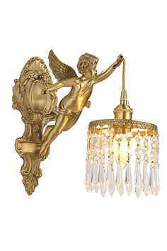 an antique brass finish wall light with angel figurine and crystal beaded shade