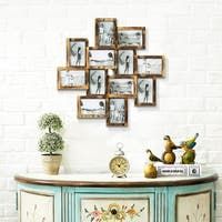 an old dresser painted in blue and white with pictures on the wall