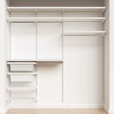 an empty white closet with shelves and bins