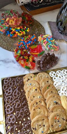 there are many different types of cookies on the table and in front of each other