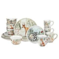 an assortment of dishes and cups with animals on them