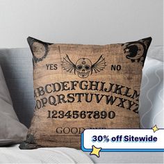 a pillow that is sitting on top of a couch with the words, abcdef g