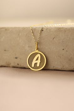 Gold Initial Pendant - Initial Gold Necklace ● Material of pendant: Solid Gold 14k ( REAL GOLD ) ● Metal Stamp: 14k ( REAL GOLD ) ● The pendant is available in 5 sizes: - 12,7 mm / 0.5 inches (Diameter) - 14,0 mm / 0,55 inches ( Diameter ) In the photos - 15,3 mm / 0.6 inches ( Diameter ) - 16,5 mm / 0,65 inches ( Diameter ) - 19,1 mm / 0,75 inches ( Diameter ) ( In the photos the size is 14mm / 0.55 inches Diameter ) ( Jump Ring inner diameter: 4 mm ) ● Material of chain: Solid gold 14k ( REAL GOLD ) It is thin and dainty and it is available in 4 sizes: - 40 cm / 15,75 inches ( Length ) - 45 cm / 17,72 inches ( Length ) In the photos - 50 cm / 19,68 inches ( Length ) - 55 cm / 21,65 inches ( Length ) ● Backside engraving is FREE ( Please use the personalization box for that.) ● If you wan Gold Pendant Necklace With Hallmarks, 14k Gold Initial Pendant Necklace With Hallmarks, Yellow Gold Round Initial Necklace For Gift, Yellow Gold Round Initial Necklace Gift, Round Yellow Gold Initial Necklace As Gift, Yellow Gold Charm Necklace With Round Pendant For Anniversary, Yellow Gold Name Necklace With Round Pendant For Gift, Gold Round Initial Necklace For Birthday, Gold Custom Necklace With Round Pendant For Anniversary