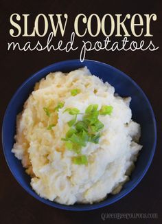 a blue bowl filled with mashed potatoes on top of a table