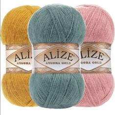 three skeins of alze vize yarn in pastel and yellow colors