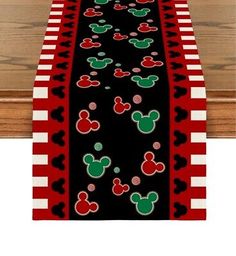 a table runner with mickey mouse heads on it