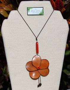 Handmade in Ecuador Necklace Length: 26 Inches Material: Tagua Nut Handmade Clasp Due to this item being handmade and the nature of the Tagua Nut the size and the color may vary from piece to piece Eco Friendly Necklace, Tagua Necklace, Necklace Orange, Tagua Nuts, Rose Orange, Rose Pendant, Orange Roses, Necklace Unique, Jade Jewelry