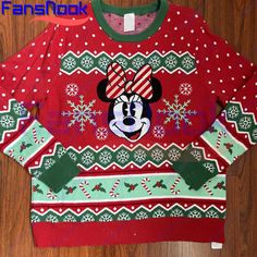 an ugly sweater with mickey mouse on it