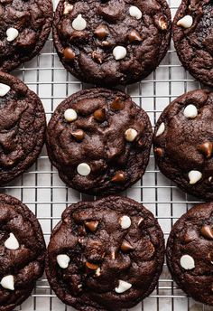 chocolate cookies with white chocolate chips on a cooling rack