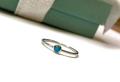 This sweet little ring is made entirely of sterling silver and features a dainty little 3mm natural blue turquoise. The band measures exactly 1mm wide, it can be worn with other rings or alone for a versatile look! The natural sleeping beauty turquoise is a 3mm round cabochon mined in Arizona, USA. It is a pure blue color with no veining or webbing, just a smooth blue color. Choose your size at check out. If you do not see your size, message me and I can help you! Comes beautifully packaged and Ring Simple Silver, Stacker Rings, Arizona Usa, Ring Simple, Sleeping Beauty Turquoise, Rings Simple, Stacking Ring, Blue Turquoise, Stackable Rings