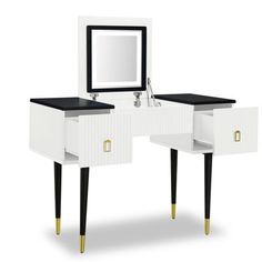 a white vanity with black top and gold legs