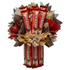 three candy bars wrapped in brown and red paper