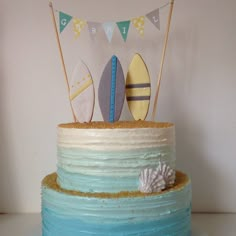 a cake decorated with surfboards and flags