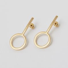 gold plated Sterling silver stud earring of a line and a circle Simple Design 14k Gold Earrings, Minimalist Yellow Gold Linear Earrings Nickel Free, Minimalist Circle Earrings For Formal Occasions, Minimalist Yellow Gold Earrings, Simple Design Modern Gold Earrings, Modern Gold Earrings With Simple Design, Modern Simple Design Gold Earrings, Yellow Gold Simple Earrings, Minimalist Gold Plated Earrings