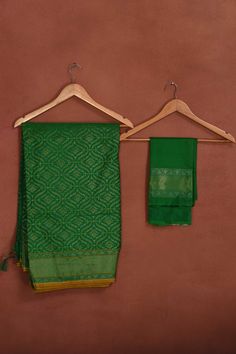 Radiate elegance on festive occasions in this beautiful green Katan silk Banarasi saree with over all zari work. The saree has yellow edging. It comes with a matching blouse piece. Disclaimer: The shown stitched blouse on the model is for display purpose only. The saree comes with a matching blouse piece and finished with fall and piko Disclaimer: The actual product may vary slightly from the image. These are custom orders, hence expect slight variation in color, placement of the motif or buta. Silk Sarees Kanchipuram, Silk Banarasi Saree, Tussar Silk Sarees, Indian Clothing Store, Latest Designer Sarees, Fashion Journals, Katan Silk, Tussar Silk Saree, Zari Work