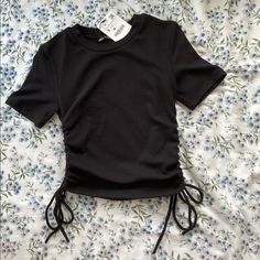 Bnwt Cinch Crop Tshirt Cinched Sides Allow You To Make It More Cropped Or More Full-Length With Cute Tie Details Trendy Crew Neck Top With Drawstring, Casual Crew Neck Top With Drawstring, Spring Drawstring Short Sleeve Tops, Spring Short Sleeve Tops With Drawstring, Casual Black Top With Drawstring, Fitted Short Sleeve Tops With Drawstring, Black Drawstring Tops For Summer, Casual Black Ruched Top, Casual Drawstring Crop Top