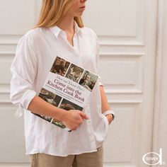 a woman holding a book in her hands