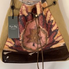 Myra Diversity Bucket Bag. Beautiful Leaf Like Patterns And Embossed Leather. A Unique Trend Of Eco-Friendly & Up- Cycled Bags With A Twist Of Vintage Style. Each Piece Is Its Own Unique Characteristics With The Best Quality Of Materials. Leather Drawstring Dual Shoulder Strap Provides Hassle Free Carrying. Interior Has Zipper And Two Slip Pockets. Exterior Has One Back Zippered Pocket. Item Width: 12.25 Item Depth: 5.5 Item Height:12.5 Nwt. (101123) (2149) Unique Characteristics, Tan Brown, Embossed Leather, Bucket Bag, Vintage Style, Shoulder Strap, Eco Friendly, Vintage Fashion, Bag Lady