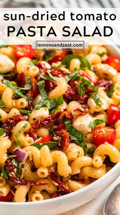 sun dried tomato pasta salad in a white bowl