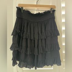 Black Boutique Skirt! Nwt Perfect Condition Black Flowy Mini Skirt For Day Out, Black Ruffled Skirt Skort For Day Out, Black Tiered Skirt For Day Out, Black Ruffled Skort For Day Out, Black Ruffled Mini Skirt For Day Out, Black Tiered Skort, Black Relaxed Fit Tiered Skort, Black Ruffled Skort, Black Cotton Mini Skirt With Ruffles