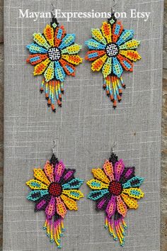 Multicolor Beaded Flower Earrings For Festivals, Multicolor Flower-shaped Festival Earrings, Multicolor Flower-shaped Earrings With Colorful Beads, Multicolor Beaded Earrings For Festivals And Gifts, Traditional Multicolor Flower Earrings, Unique Multicolor Flower Earrings, Unique Multicolor Handmade Flower Earrings, Unique Multicolor Flower-shaped Beaded Earrings, Festival Multicolor Flower Beaded Earrings