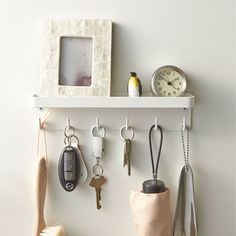 there is a shelf with keys and other items on it