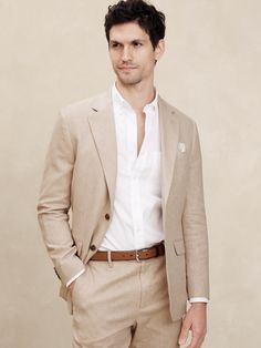 LINEN-BLEND: This light and breathable fabric is a must for those warm days and styles effortlessly for all occasions. Customer favorite linen-blend jacket returns with matching trousers this season to complete the full suit look. Notch collar with button hole on wearers left panel. Four non-functioning buttons at cuffs. Two-button front closure. Front pockets. Chest pocket. Internal pockets. Single back vent. Matching suit trouser available. Made exclusively for Banana Republic Factory. #873658 Fashionable Mens Suits, Tan Suit Men, Blazer Men Outfit, Day Wedding Outfit, Semi Formal Wedding Attire, Suits For Guys, Mens Linen Suit