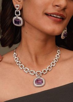 Lustrous Light Purple Faux Amethyst Pink Mint AAA crystal-work combines with a delicate White gold frame to immediately effuse any ensemble with a dramatic dose of evening elegance! The set includes a pair of matching dangle earrings. Approximate earrings length is 1.8 inches Length of the necklace: approximately 16 inches and has adjustable chains  A set designed with a loving attention to detail and will add splendor to any attire! Customized orders takes 3 to 4 weeks, depending on piece requirements. The Ombre Designs Jewelry pieces can be customized in accordance with your requirement. Please Email or Whats app on : +91 8448833193 / sonalikamehra [!at] theombredesigns.com Luxury Dazzling Amethyst Jewelry, Luxury Purple Faceted Necklace, Diamond Cuban Link Chain, Hell Lila, Purple Mauve, Cuban Link Chain Necklaces, Jewelry Dainty, Link Chain Necklace, Amethyst Jewelry