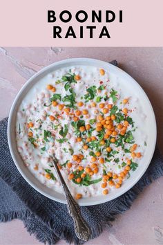 a white bowl filled with rice and garnished with carrots