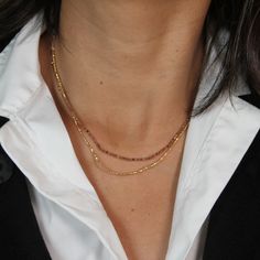 One of our favorite Mabel Chong necklaces! This double-style necklace features a strand of faceted Andalusite beads and a strand of Gold Filled beads attached to a 16" Gold Filled Cable Chain with an adjustable length. Get a beautiful layered look in one piece! Approx. Length: 16-18" Adjustable Double Strand Beaded Necklaces For Layering, Double Strand Beaded Necklace For Layering, Double Strand Beaded Chain Necklace For Layering, Gold Beaded Necklaces With Faceted Beads For Everyday, Gold Beaded Necklace With Faceted Beads For Everyday, Faceted Beads Lariat Necklace Gift, Adjustable Lariat Necklace With Faceted Beads, Double Strand Beaded Chain Necklaces, Gold Rondelle Beaded Necklaces