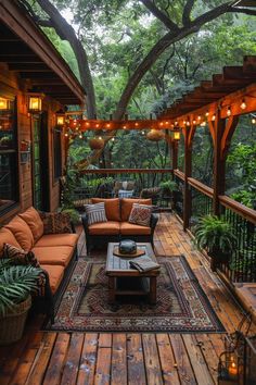 an outdoor living area with couches, tables and lights