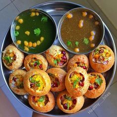 a metal bowl filled with different types of food