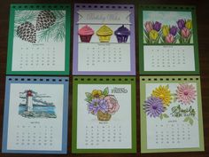 four calendars with pictures of flowers and cupcakes on them, all decorated in different colors