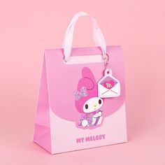 a pink hello kitty bag with a tag on it that says'my melody '