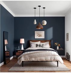 two pictures of a bedroom with blue walls