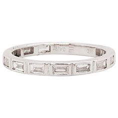 This modern diamond baguette band is a clean, sleek design. With natural baguette diamonds set East to West in bezel settings. This band has a seamless, bright white look! The diamonds are G-H color and VS-1 Clarity, very clear and very white! The bezel settings frame each diamonds perfectly with a bright white 14k white gold. This ring is so beautiful worn alone or can be paired with your engagement ring or right hand ring! It's versatile and looks great with everything. Frame this band between Modern White Diamond Ring With Baguette Diamonds, Modern Silver Diamond Ring With Baguette Diamonds, Modern White Gold Diamond Ring With Baguette Diamonds, Modern Channel Set Baguette Cut Diamond Ring, Modern Baguette Cut Diamond Ring With Bezel Setting, Diamond Baguette Band, Baguette Diamond Band, Baguette Band, Baguette Diamond Ring