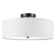 a ceiling light with a white shade on it