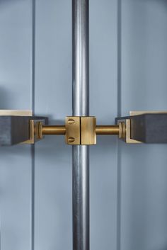 a close up of a metal pole with two handles