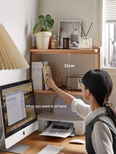 a woman sitting at a desk in front of a computer monitor with the text, what you want is at hand