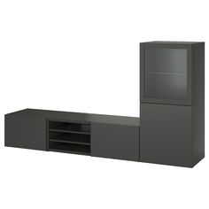 a gray entertainment center with glass doors and shelves