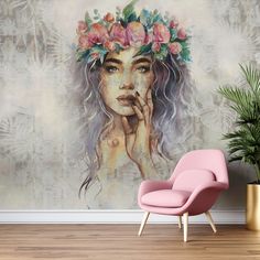 a woman with flowers on her head and hands to her face in front of a wall mural