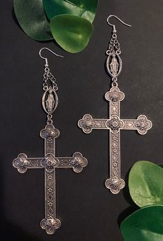 Beautiful silver plated cross earrings with the touch of a Virgin Mary charm. Fish hook earrings can make into clasps hooks. These earrings are definitely a must have. Nickel-free Metal Cross Earrings, Cross Shaped Metal Earrings For Pierced Ears, Silver Metal Cross Pendant Earrings, Handmade Metal Cross Earrings, Silver Cross Pendant Earrings, Nickel-free, Silver Cross Pendant Pierced Earrings, Silver Cross Pendant Earrings, Nickel Free, Silver Cross Pendant Earrings, Silver Nickel-free Cross Pendant Earrings