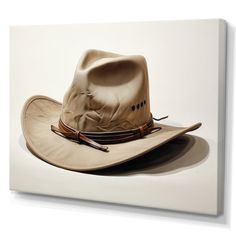 a white cowboy hat with brown leather band and two arrows on the brim, against a white background