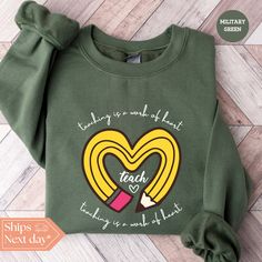 All of our Teaching Is a Work of Heart hoodies are handmade to order on an ultra soft crewneck that will quickly become your go to apparel item! You will never want to take it off! Our Teacher sweatshirts are handmade to order with eco-friendly water based ink that feels good and lasts longer! ♥The details♥ This unisex sweatshirt is crafted from soft, breathable fabric for ultimate comfort. Printed with an eco-friendly water-based ink, this sweater not only looks great but also supports sustainable practices. The unisex sizing allows for a versatile fit, but we suggest sizing up for a more relaxed look. To keep your crewneck looking its best, we recommend washing it on cold and either hanging it to dry or tumble drying it on low heat. Be sure to avoid ironing directly on the design to pres New Teacher Gift, New Teacher Gifts, Teach Love Inspire, Teacher Sweatshirt, New Teacher, Teacher Inspiration, Heart Hoodie, Heart Sweatshirt, Kindergarten Teacher