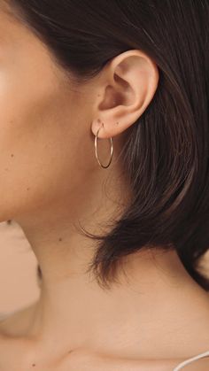 Our large gold hoop earrings are dainty and classic, making them perfect for everyday wear. Hoops measure at 30mm Classic Small Hoop Earrings In 14k Gold Filled, Classic Round Hoop Earrings For Everyday, Small Hoop Earrings For Everyday Elegance, Dainty Hoop Earrings For Everyday Elegance, Classic Everyday Gold Hoop Earrings, Delicate Everyday Hoop Jewelry, Classic Everyday 14k Gold Filled Hoop Earrings, Classic Circle Earrings For Everyday, Elegant 14k Gold Filled Circle Hoop Earrings