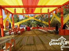 an outdoor event with orange and yellow decorations