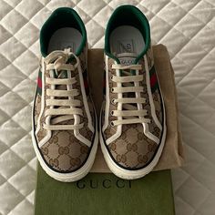 Gucci Tennis 1977 Sneakers Worn Once I’m An 8.5 Woman Women's Gucci Tennis 1977 Sneaker In Gg Original Canvas Contrast Details Green And Red Web Green Grosgrain Trim Gucci Tennis 1977 Label Gg Motif At The Sole Rubber Sole 0.6" Height Made In Italy Designer High-top Lace-up Sneakers With Embroidered Logo, Designer Lace-up High-top Sneakers With Embroidered Logo, Gucci Custom Lace-up Sneakers With Logo Print, Designer Gucci Sneakers With Laces, Gucci Lace-up Sneakers With Embroidered Logo, Designer High-top Sneakers With Embroidered Logo, Designer Gucci Sneakers, Gucci Leather High-top Sneakers With Embroidered Logo, Gucci Designer High-top Sneakers With Embroidered Logo