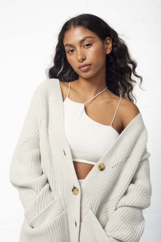 This Navi Oversized Cardigan features chunky short-rowing and intricate pointelle holes that provide a cozy look and unbeatable comfort. Enjoy the oversized cut and classic design that makes this cardigan perfect for any occasion. Oversized fit. If you are an XS-S we recommend getting size S. If you are a M-L we recommend getting size L. 100% Wool Model is 5'7" and wearing a size small Oversized Open Knit Chic Outerwear, Chic Oversized Cropped Sweater In Chunky Knit, Chic Oversized Chunky Knit Cropped Sweater, Chic Oversized Cable Knit Cardigan, Trendy Chunky Knit Everyday Cardigan, Trendy Chunky Knit Cardigan For Everyday, Trendy Chunky Knit Cardigan, Trendy Oversized Open Knit Cardigan, Trendy Oversized Open Knit Sweater Coat